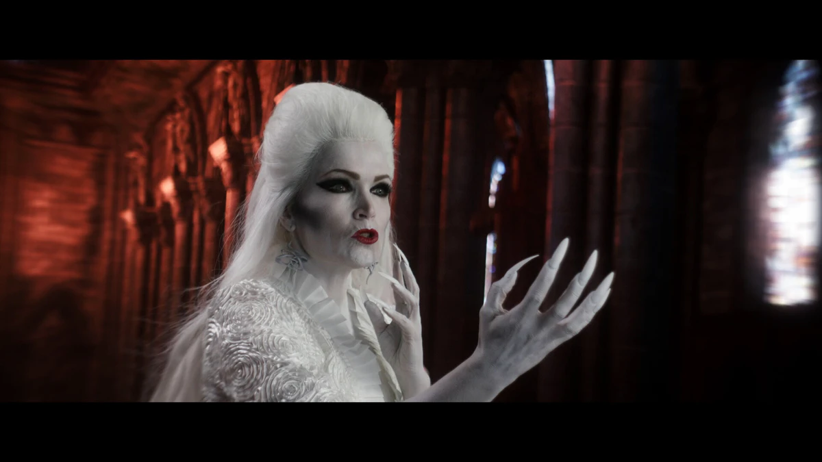 Shot: a white figure in a gothic interior