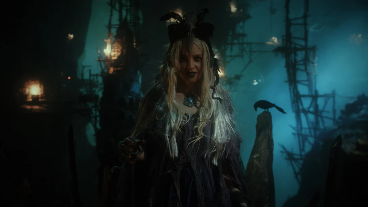 Shot: a woman in a hat against shipwrecks
