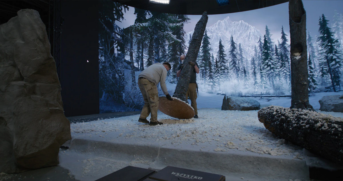 On set: a winter forest on the LED wall and a snowy foreground set